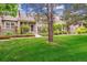 Charming townhome featuring well-manicured lawn and beautiful stone accents at 570 Clarendon Loop, Castle Pines, CO 80108