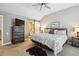 Bright main bedroom featuring vaulted ceiling, soft carpet and ensuite bathroom at 570 Clarendon Loop, Castle Pines, CO 80108