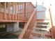 Back deck with wooden stairs leading to a fenced backyard at 18874 E Ida Ave, Aurora, CO 80015