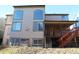 Two-story house exterior with a deck and backyard view at 18874 E Ida Ave, Aurora, CO 80015