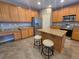 Kitchen boasts granite counters, stainless steel appliances, and wood cabinets at 18874 E Ida Ave, Aurora, CO 80015