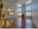 Spacious living room with hardwood floors, a fireplace, and large windows at 18874 E Ida Ave, Aurora, CO 80015