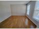 Simple living room with hardwood floors and neutral walls at 18874 E Ida Ave, Aurora, CO 80015