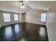 Spacious living room featuring hardwood floors and a ceiling fan at 18874 E Ida Ave, Aurora, CO 80015