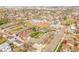Wide aerial view of the neighborhood featuring multi-Gathering housing and nearby school with solar panels at 4201 Shoshone St, Denver, CO 80211