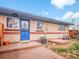 Charming backyard with a wooden deck, grass, and secure fencing, providing privacy and space for outdoor activities at 4201 Shoshone St, Denver, CO 80211