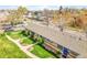 Lovely exterior view of a multi-Gathering home, featuring a landscaped lawn, and blue doors and windows at 4201 Shoshone St, Denver, CO 80211