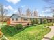 Inviting exterior of this home offers a well-manicured lawn and walkway leading to the entrance at 4201 Shoshone St, Denver, CO 80211