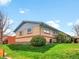 Property exterior featuring green grass, brick accents, and a neatly manicured lawn, offering curb appeal at 4201 Shoshone St, Denver, CO 80211