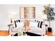 Cozy living room with stylish decor, comfortable sofa, and elegant lighting for a welcoming atmosphere at 4201 Shoshone St, Denver, CO 80211