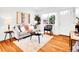 Bright living room with wood floors, modern furniture, stylish decor, and plenty of natural light at 4201 Shoshone St, Denver, CO 80211