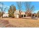 Backyard view featuring a wooden deck with gazebo, an auxiliary building, trees, and spacious lawn area at 6681 S Abilene Way, Centennial, CO 80111