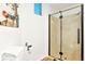Bathroom features a modern shower with glass door, a stylish vanity, and tile flooring at 6681 S Abilene Way, Centennial, CO 80111