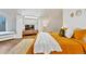 Cozy bedroom features hardwood floors, built-in window seating, and soft, inviting bedding at 6681 S Abilene Way, Centennial, CO 80111