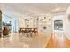 Open-concept dining room with built-in shelving and access to outdoor spaces at 6681 S Abilene Way, Centennial, CO 80111