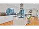 Modern kitchen features stainless steel appliances, island cooktop, and ample counter space at 6681 S Abilene Way, Centennial, CO 80111