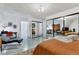 Spacious main bedroom features an ensuite bathroom, a sleek workstation, and comfortable seating at 6681 S Abilene Way, Centennial, CO 80111
