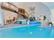 Indoor pool and spa feature a stone staircase, lounge area, and contemporary design at 6681 S Abilene Way, Centennial, CO 80111