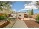 Exterior shot of the backyard with outdoor seating, patio area, and a shed at 2170 W Warren Ave, Englewood, CO 80110