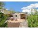Backyard with patio seating, landscaping and a shed with covered area at 2170 W Warren Ave, Englewood, CO 80110