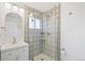 Remodeled bathroom with walk-in shower and modern sink at 2170 W Warren Ave, Englewood, CO 80110