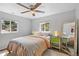 Bedroom with ceiling fan, natural light, and view to the backyard at 2170 W Warren Ave, Englewood, CO 80110