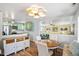 Cozy dining area featuring a round table, hardwood floors, and stylish lighting at 2170 W Warren Ave, Englewood, CO 80110