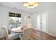 Dining room with pendant lighting and view of the covered patio at 2170 W Warren Ave, Englewood, CO 80110