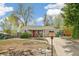 Charming home featuring a well-maintained front yard, a red front door, and a manicured landscape at 2170 W Warren Ave, Englewood, CO 80110