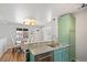 Open concept kitchen with stainless steel dishwasher and granite countertop at 2170 W Warren Ave, Englewood, CO 80110