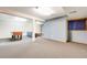 Spacious basement featuring carpet, foosball table, and plenty of open area to relax and play at 11710 Elk Head Range Rd, Littleton, CO 80127