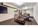 Carpeted basement with a window, features a comfortable sofa and plenty of space at 11710 Elk Head Range Rd, Littleton, CO 80127