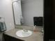 Bathroom featuring a clean vanity with a mirror and towel rack at 11710 Elk Head Range Rd, Littleton, CO 80127
