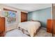 Bedroom with carpet flooring, a window, a closet, and neutral-colored walls at 11710 Elk Head Range Rd, Littleton, CO 80127