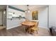 Charming dining room featuring hardwood floors and a stylish, classic table at 11710 Elk Head Range Rd, Littleton, CO 80127