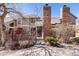 Inviting front exterior with brick pillars and detailed stonework create a distinguished street presence at 11710 Elk Head Range Rd, Littleton, CO 80127