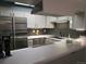 Well-lit kitchen boasts updated appliances and ample counter space at 11710 Elk Head Range Rd, Littleton, CO 80127