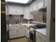 Modern kitchen with stainless steel appliances and gray backsplash at 11710 Elk Head Range Rd, Littleton, CO 80127