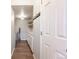 Convenient laundry room features wooden floors, washer, dryer, ample storage, and shelving for easy organization at 11710 Elk Head Range Rd, Littleton, CO 80127