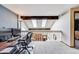 Loft area showing a unique view with a beamed ceiling, skylights, and a window overlooking the lower level at 11710 Elk Head Range Rd, Littleton, CO 80127