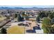 Aerial view of the home showing the expansive yard, landscaping, and mountain views at 8900 W Hampden Ave, Denver, CO 80227