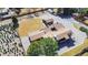 Overhead view of the property revealing its extensive grounds, mature trees, and convenient parking areas at 8900 W Hampden Ave, Denver, CO 80227