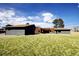 Large backyard featuring a well-manicured lawn, ideal for outdoor entertainment and activities at 8900 W Hampden Ave, Denver, CO 80227