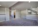 Finished basement with neutral walls and carpet, recessed lighting, and access to a bathroom at 8900 W Hampden Ave, Denver, CO 80227