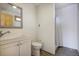 Small bathroom with a white vanity, toilet and shower at 8900 W Hampden Ave, Denver, CO 80227