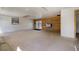 Bright garage with wood accent wall, double doors to back, and side door to yard at 8900 W Hampden Ave, Denver, CO 80227