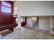 Open floor plan featuring multiple living spaces with stairs leading to an upstairs area at 8900 W Hampden Ave, Denver, CO 80227