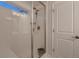 Bathroom with a walk-in shower featuring a glass door and modern fixtures at 17203 Birds Foot Ave, Parker, CO 80134