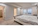 Comfortable bedroom with carpet, natural light, and simple bed frame and furniture at 17203 Birds Foot Ave, Parker, CO 80134