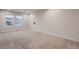 Spacious bedroom with neutral carpet, large window, and ample natural light at 17203 Birds Foot Ave, Parker, CO 80134